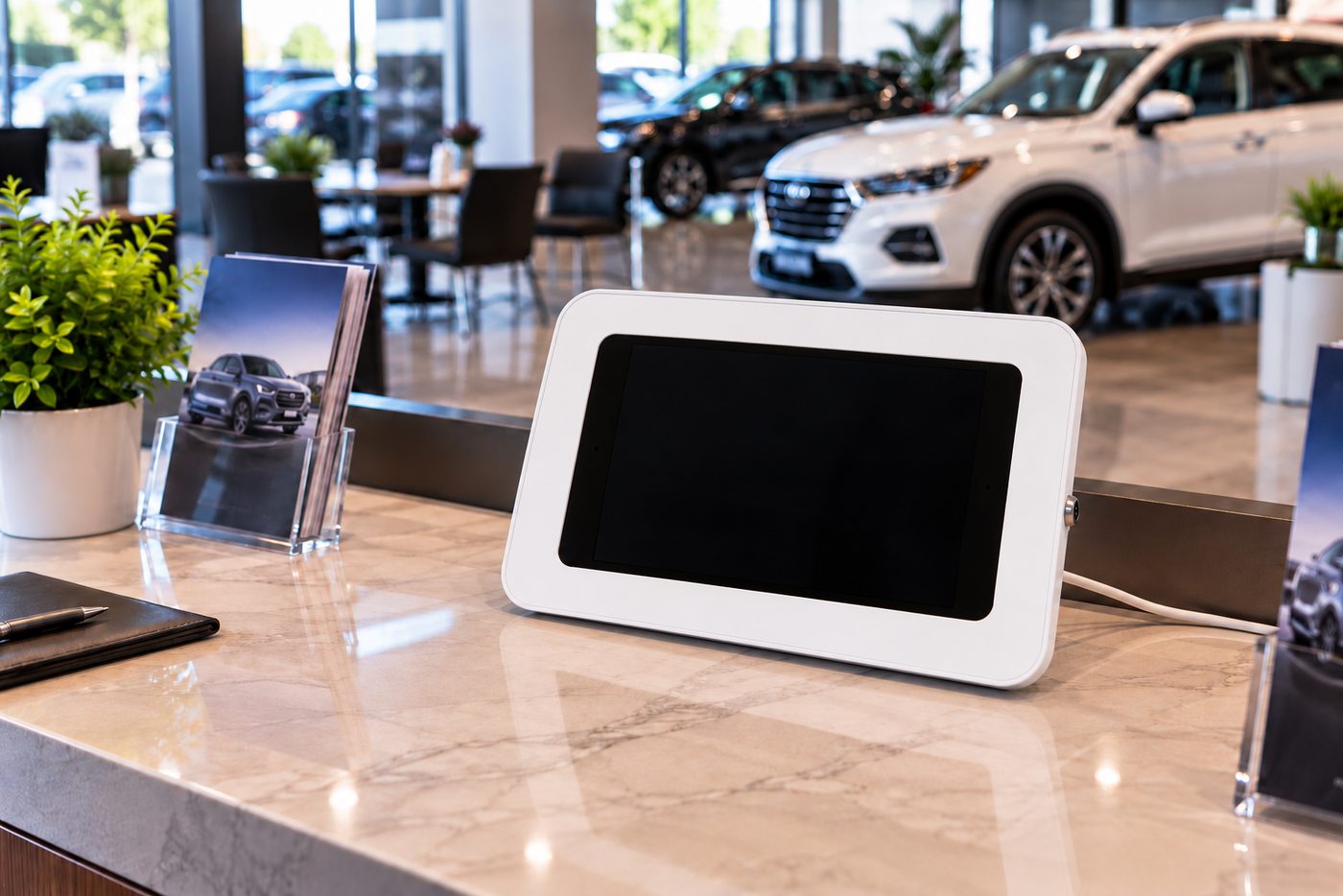 Kiosk at a car dealership desk